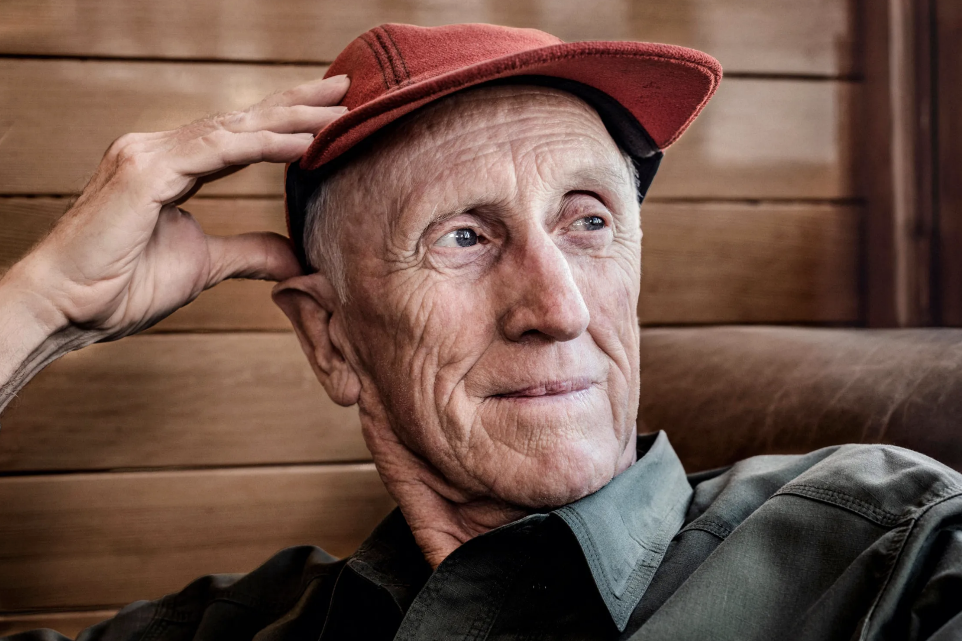 A photo of Stewart Brand wearing a red cap