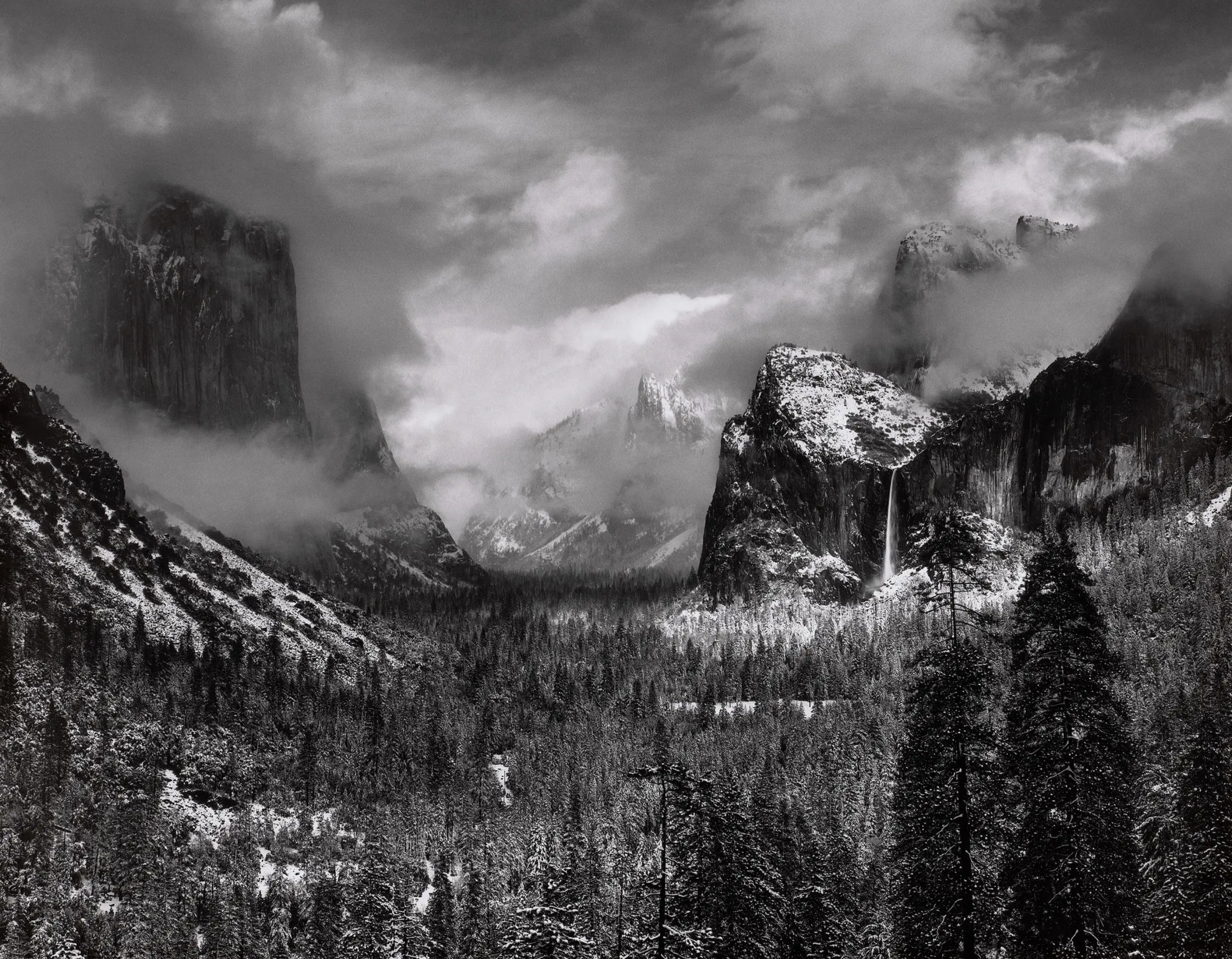 A black-and-white photograph of Yosemite Valley taken by Ansel Adams