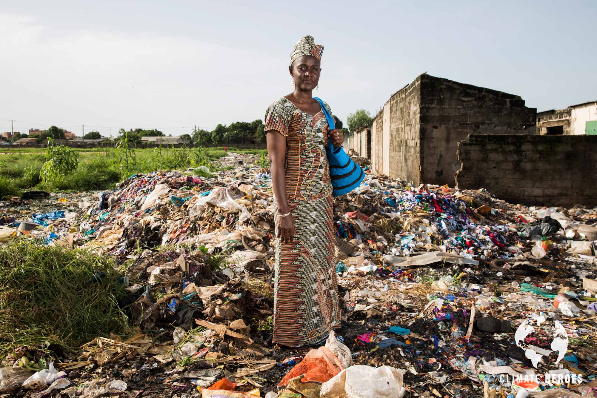 Isatou Ceesay standing at a waste dump